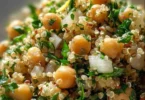 Lemon Herb Quinoa with Chickpeas served in a bowl, garnished with fresh herbs.