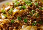 Low-carb Mongolian ground beef served with sautéed cabbage in a bowl
