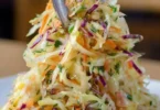 Bowl of Old Fashion Sauerkraut Salad with vegetables and dressing