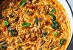 Quick ground beef orzo in tomato cream sauce served in a bowl