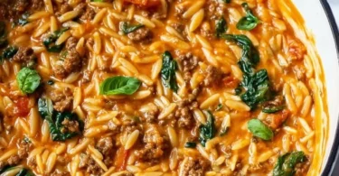 Quick ground beef orzo in tomato cream sauce served in a bowl