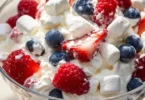 Red White and Blue Cheesecake Salad with fresh berries and creamy dressing