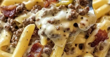 Delicious plate of cheesy beef and bacon pasta with herbs garnishing