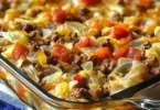 Hearty cabbage and beef bake in a casserole dish, garnished and ready to serve.
