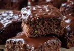High-protein zucchini brownies with a chocolate glaze on a plate