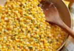 Honey butter skillet corn served in a cast iron pan