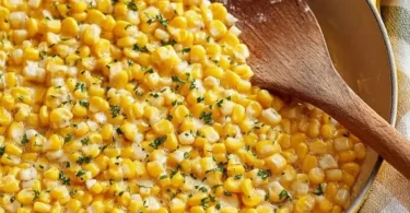 Honey butter skillet corn served in a cast iron pan