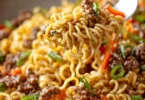 Delicious slow cooker beef ramen noodles served in a bowl with fresh vegetables.